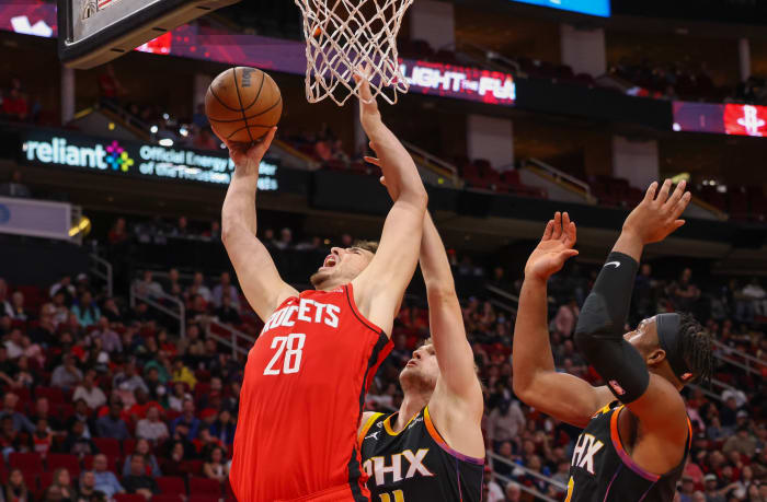 Rockets center Alperen Sengun shoots against Phoenix Suns center Jock Landale (11) in the second half at Toyota Center.